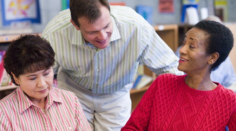 male trainer with two female peer support workers